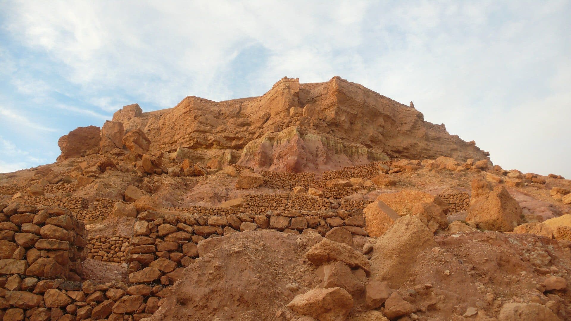 Earthen kasbah architecture of Ait Ben Haddou at sunset, the kind of High Atlas landscape this day tour is built around.