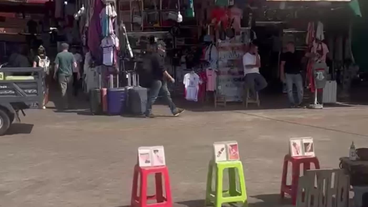 Henna artists' stools with design boards in Jemaa el-Fna