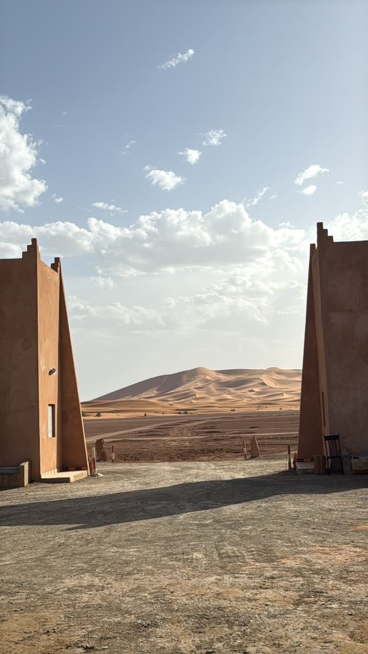 The gate of our Erg Chebbi desert camp, with the dunes behind it.
