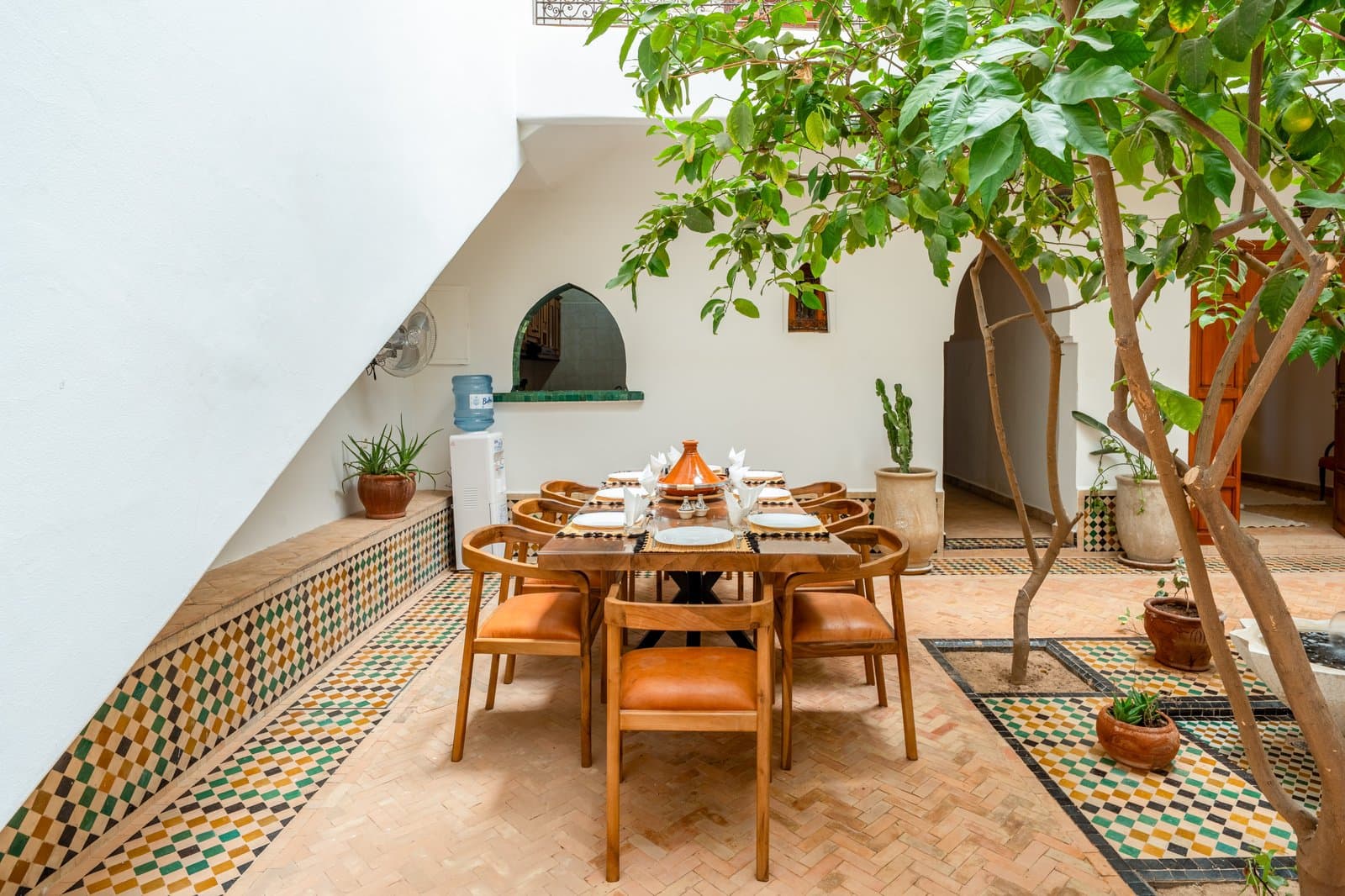 Courtyard dining table set with a tagine at Riad Bab Atlas.