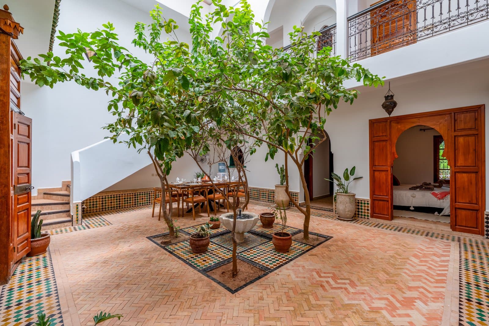 Dining: Courtyard fountain trees dining bedroom door