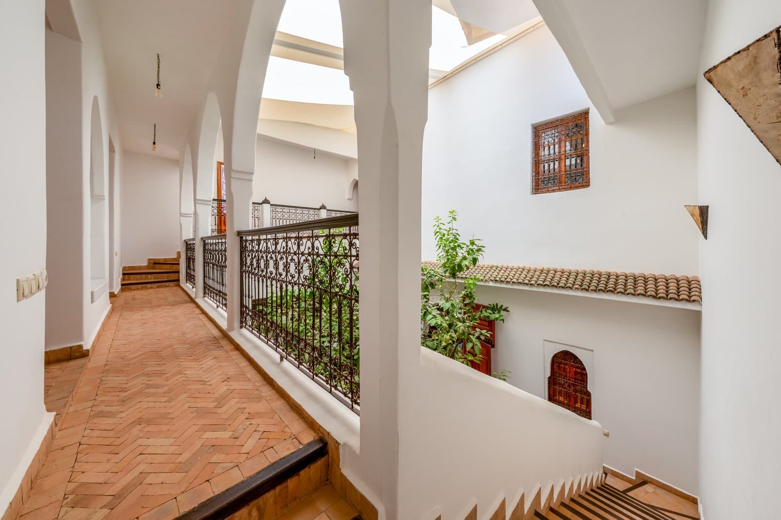 Hall: Upper hallway stairs herringbone tiles