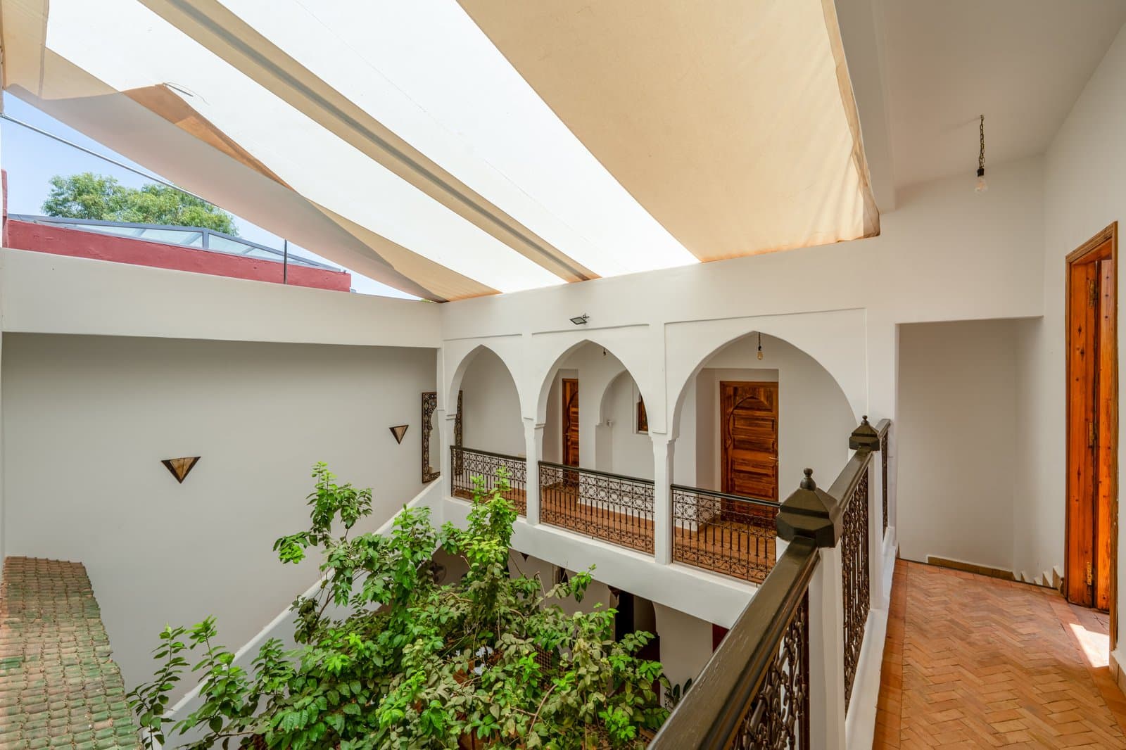 Hall: Upper courtyard gallery under shade sail