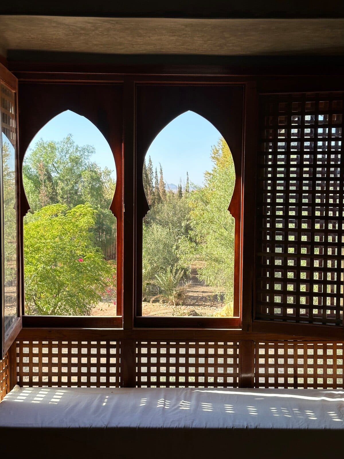 Shaded interior seating at Riad Bab Atlas looking onto the garden.